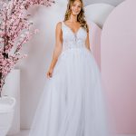 G295 Sweet lace blossoms and trailing vines cover the bodice of this amazing A-line gown