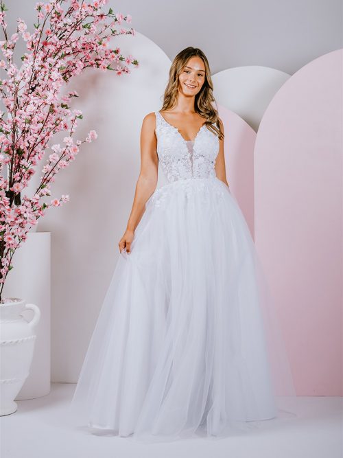 G295 Sweet lace blossoms and trailing vines cover the bodice of this amazing A-line gown