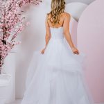 G296 All frills and ruffles, a full tulle skirt pairs perfectly with the strapless sweetheart neckline