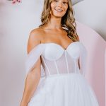 G302 UNLINED a translucent bodice, leaving the boning exposed, with soft draped sleeves